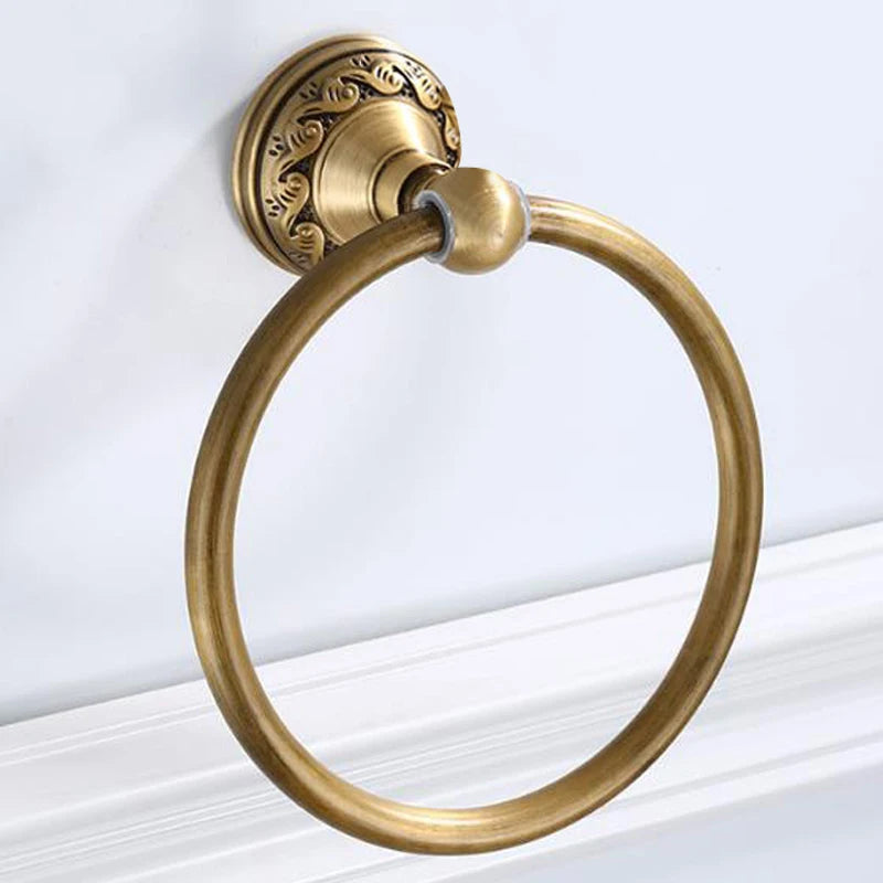Round aluminum wall-mounted towel rack for bathrooms, with an antique brass finish.