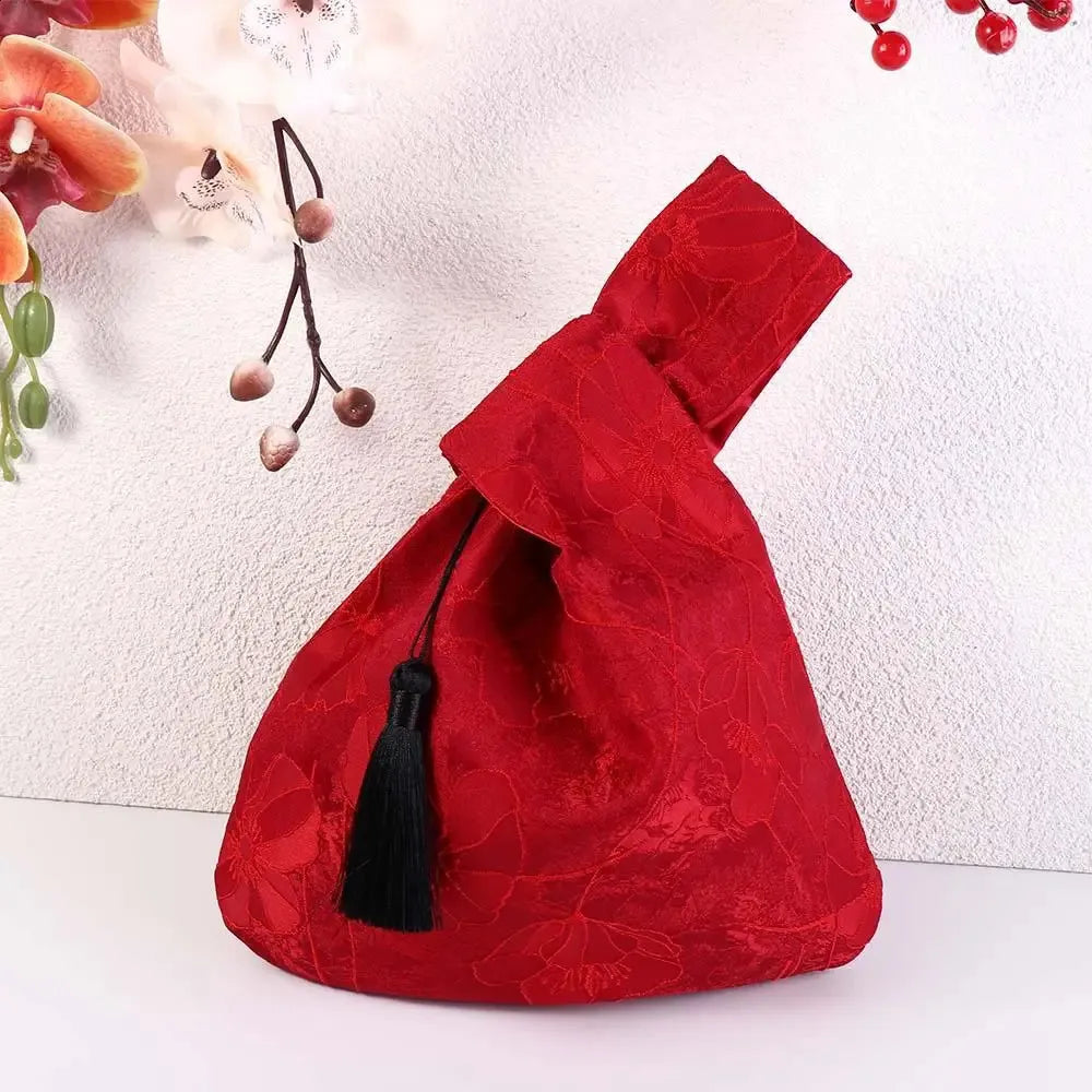 Handbag with floral embroidery and a tassel charm, elegant and charming