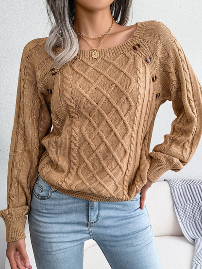 Women's sweater with puff sleeves, textured buttons, and a round neck