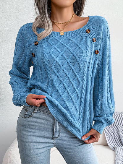 Women's sweater with puff sleeves, textured buttons, and a round neck