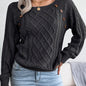 Women's sweater with puff sleeves, textured buttons, and a round neck