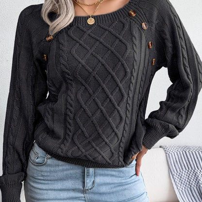 Women's sweater with puff sleeves, textured buttons, and a round neck