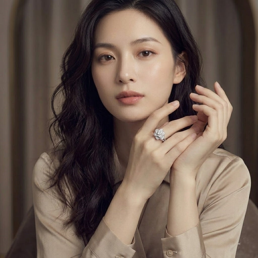 Elegant women's ring in premium 925 sterling silver featuring a three-dimensional design of intertwined roses and white cubic zirconia