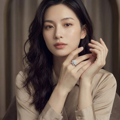 Elegant women's ring in premium 925 sterling silver featuring a three-dimensional design of intertwined roses and white cubic zirconia