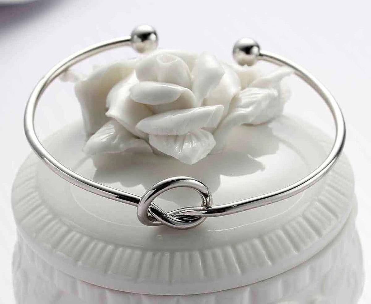 Women's rigid stainless steel bracelet with knot detail