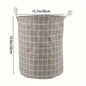 Round, portable fabric laundry basket, ideal for the laundry room or bathroom