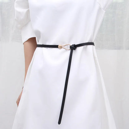 Women's leather belt with a stylish and versatile metal buckle, ideal for pairing with dresses, coats, and sweaters