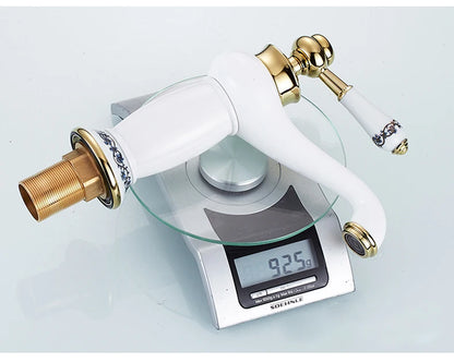 Bathroom faucet with antique bronze finish, made of solid brass, for washbasin, with single lever and water mixer