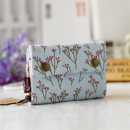 Women's wallet with cartoon print for girls, with key holder and coin purse in various designs.