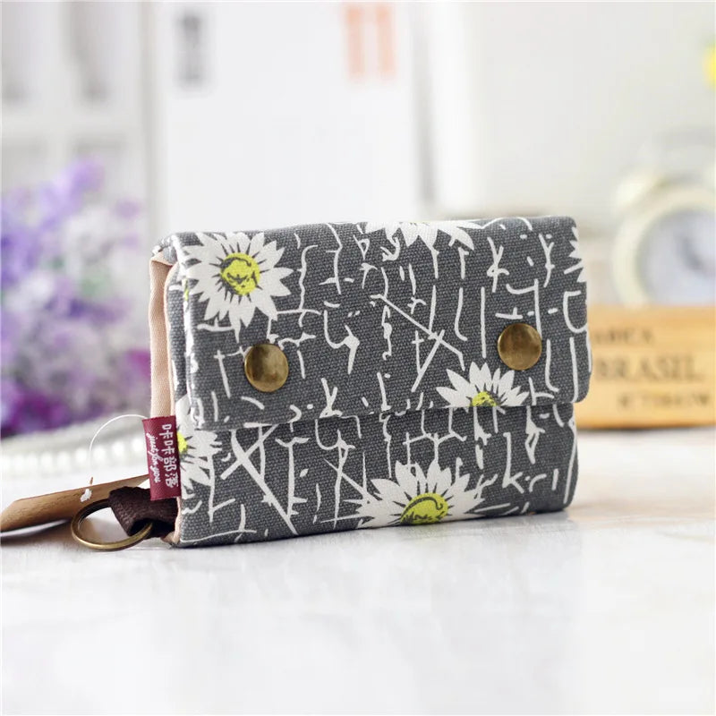 Women's wallet with cartoon print for girls, with key holder and coin purse in various designs.
