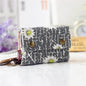 Women's wallet with cartoon print for girls, with key holder and coin purse in various designs.