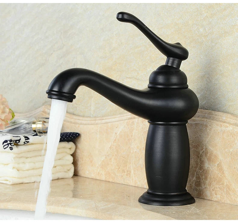 Bathroom faucet with antique bronze finish, made of solid brass, for washbasin, with single lever and water mixer