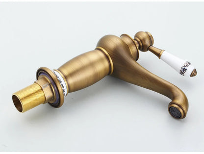 Bathroom faucet with antique bronze finish, made of solid brass, for washbasin, with single lever and water mixer