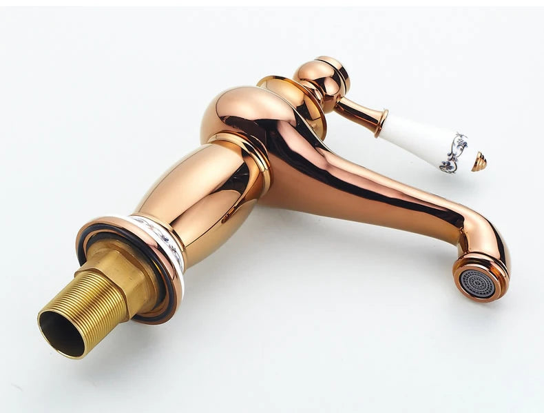 Bathroom faucet with antique bronze finish, made of solid brass, for washbasin, with single lever and water mixer