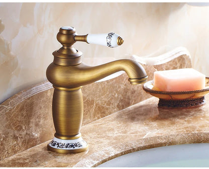 Bathroom faucet with antique bronze finish, made of solid brass, for washbasin, with single lever and water mixer
