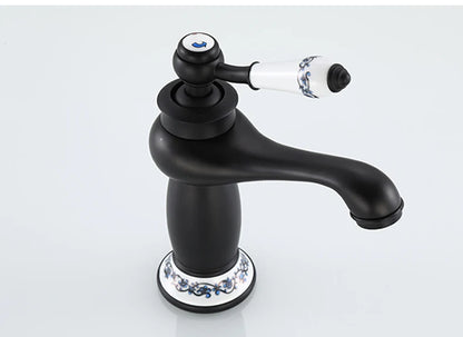 Bathroom faucet with antique bronze finish, made of solid brass, for washbasin, with single lever and water mixer