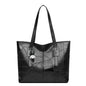 Stylish and elegant women's square tote bag with a horizontal zipper, suitable for carrying by hand or on the shoulder