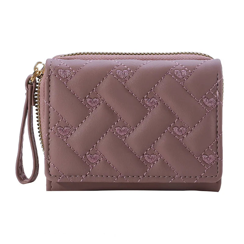 Small women's wallet in leather, elegant design, available in various colors.