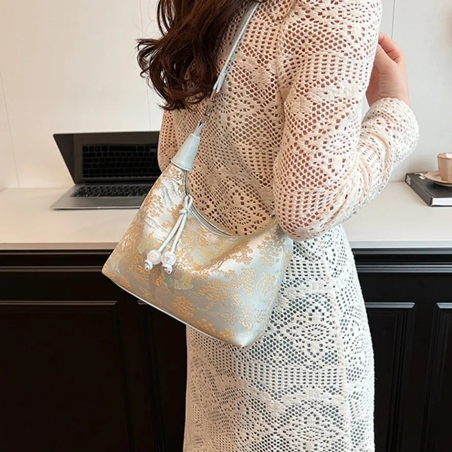 Women's embroidered handbag with zipper, made of silky fabric, adjustable strap