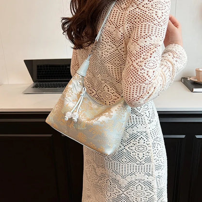 Women's embroidered handbag with zipper, made of silky fabric, adjustable strap