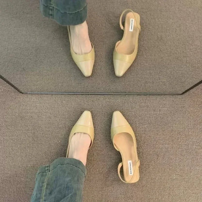 Women's low-heeled shoe with a pointed toe, chunky heel, and comfortable fit