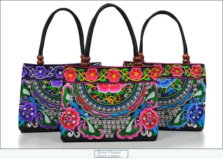 Small women's shoulder bag with floral embroidery, top handle, and flap with bead embellishments