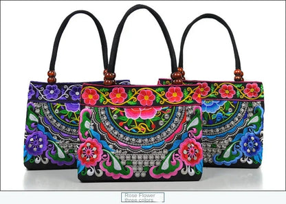 Small women's shoulder bag with floral embroidery, top handle, and flap with bead embellishments
