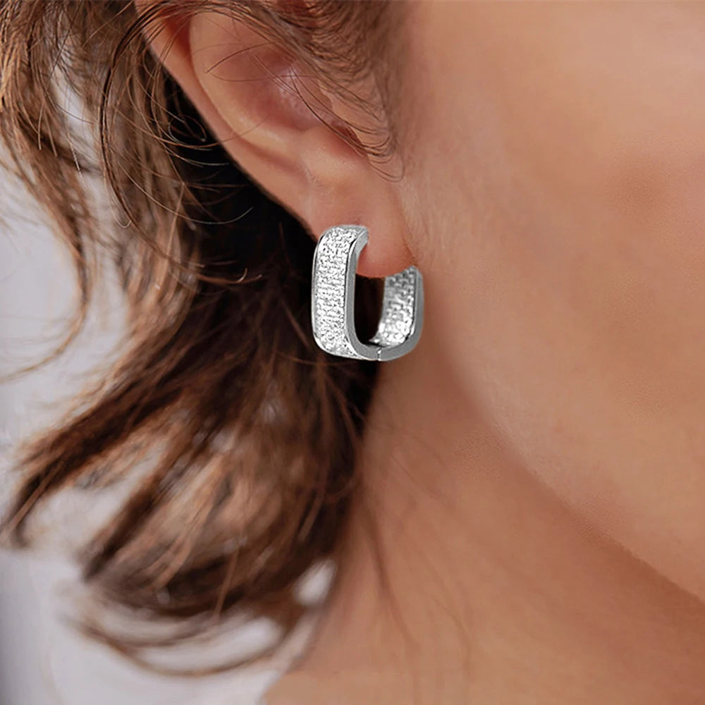 Women's silver or gold hoop earrings set with cubic zirconia
