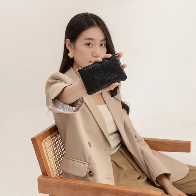 Small and elegant women's wallet with zipper closure, card holder and key holder