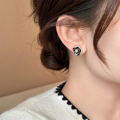 Black Camellia earrings with embedded cubic zirconia and rhinestones, modern and delicate