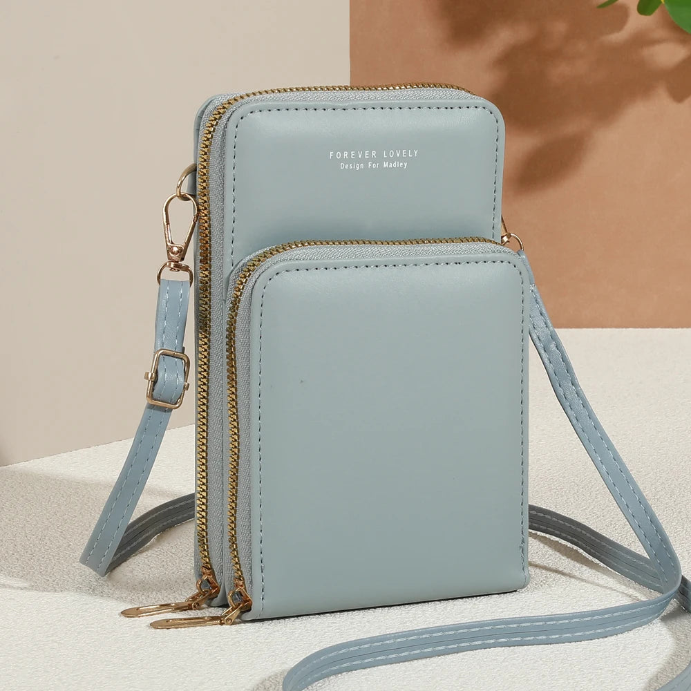 Modern, compact, and secure women's cell phone bag. Holds phones, cards, and documents