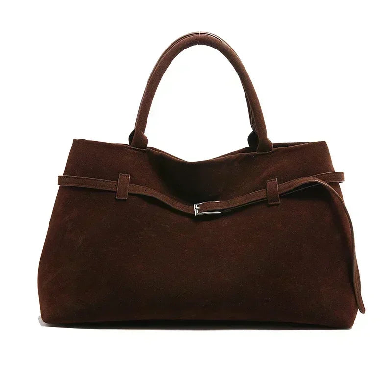 Women's handbag made of synthetic suede with a decorative buckle, large capacity, and snap closure