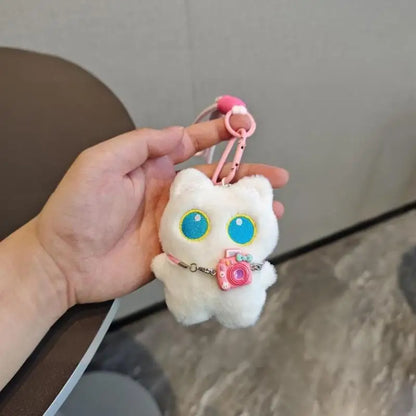 Black and white kitten keychain with big, cute eyes, cartoon plush pendant