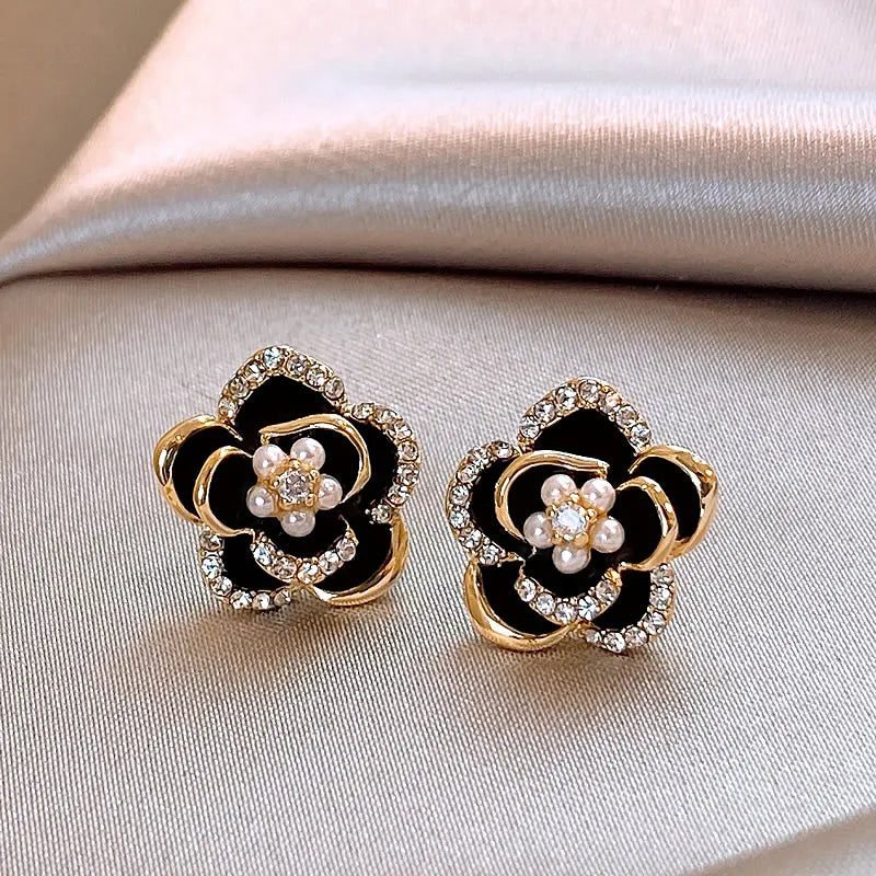 Black Camellia earrings with embedded cubic zirconia and rhinestones, modern and delicate
