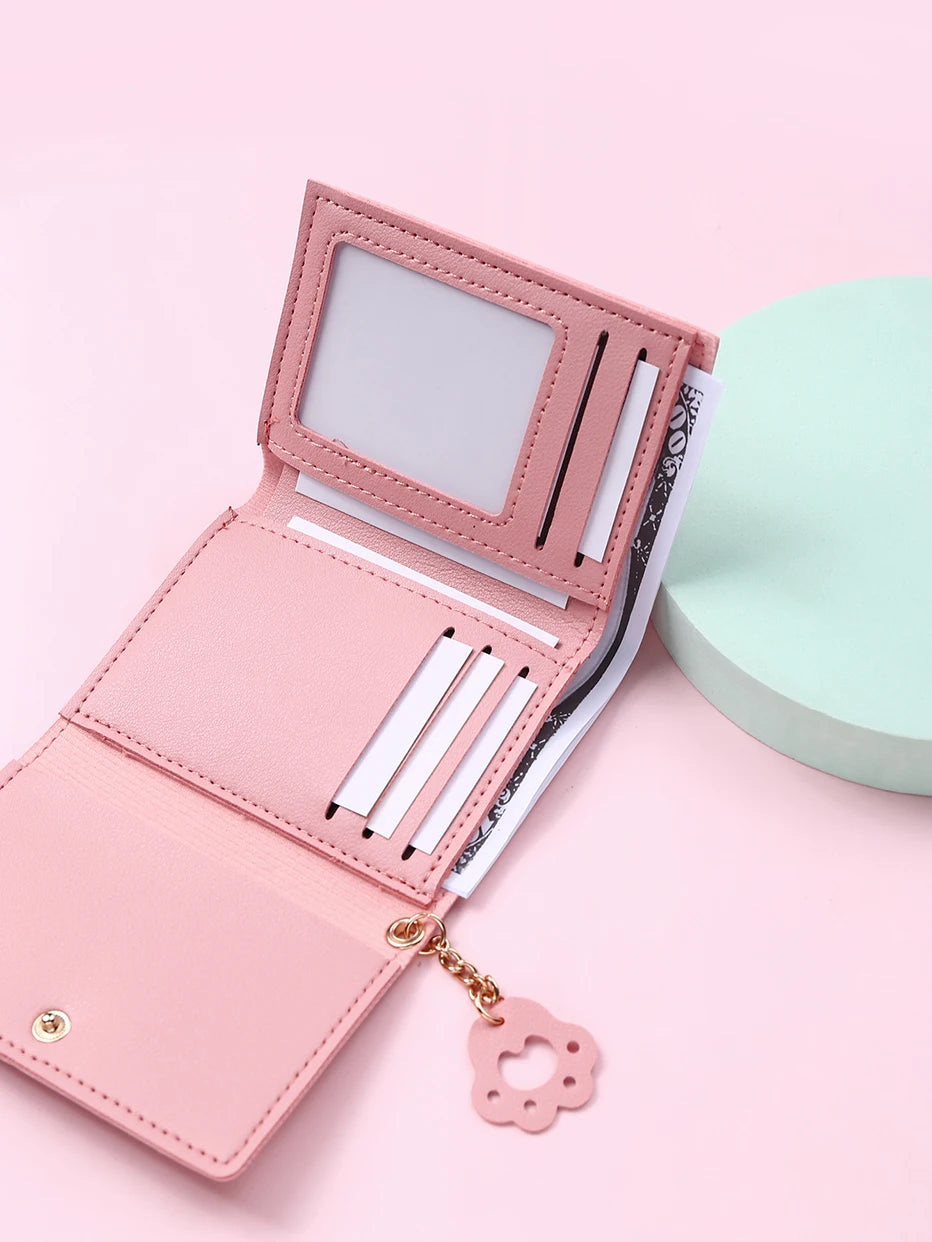 Small and compact women's wallet for girls with a cat print, featuring card slots and a bill compartment.