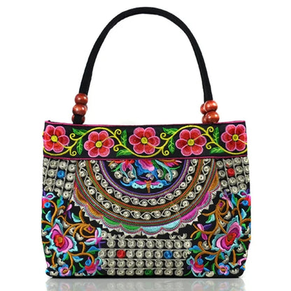 Small women's shoulder bag with floral embroidery, top handle, and flap with bead embellishments
