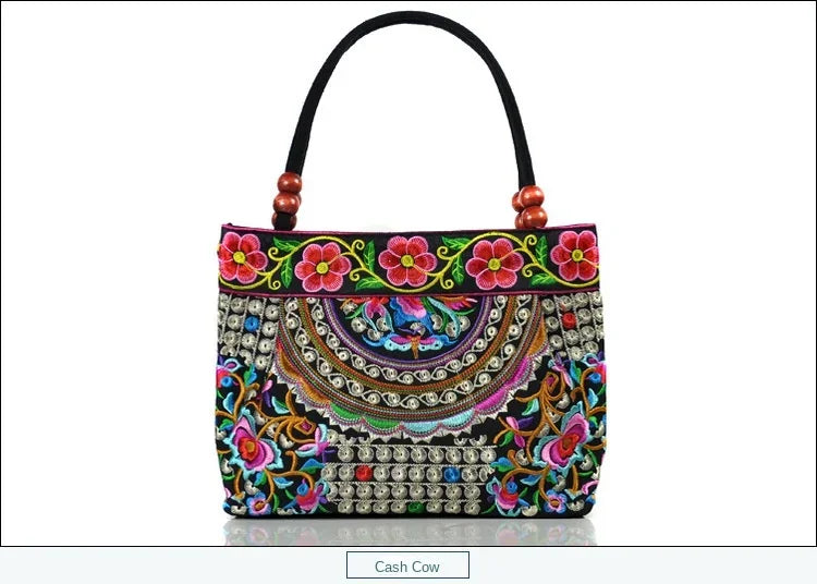 Small women's shoulder bag with floral embroidery, top handle, and flap with bead embellishments