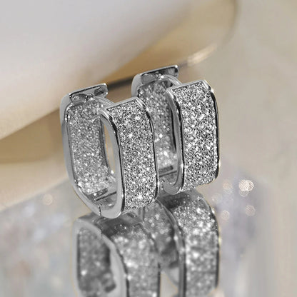 Women's silver or gold hoop earrings set with cubic zirconia