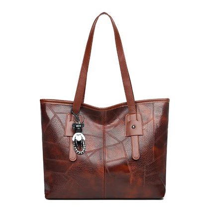 Stylish and elegant women's square tote bag with a horizontal zipper, suitable for carrying by hand or on the shoulder