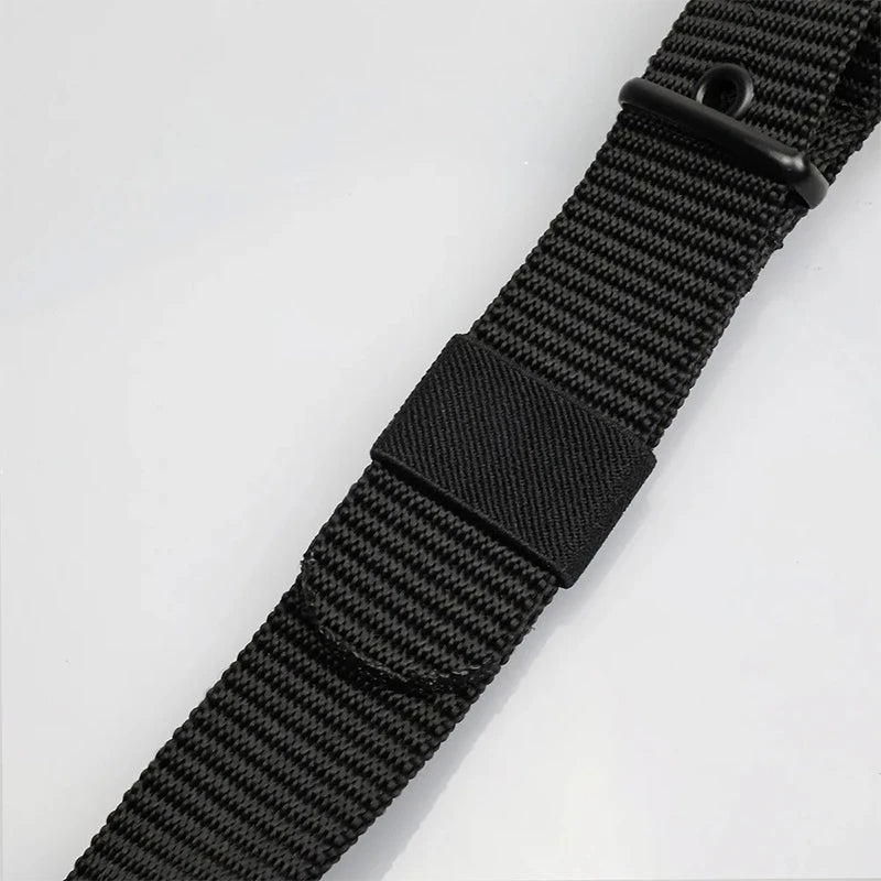 Unisex canvas belt with pin buckle and leather detail. Modern with eyelets and perfect for wearing with jeans.