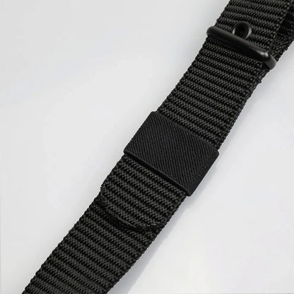 Unisex canvas belt with pin buckle and leather detail. Modern with eyelets and perfect for wearing with jeans.