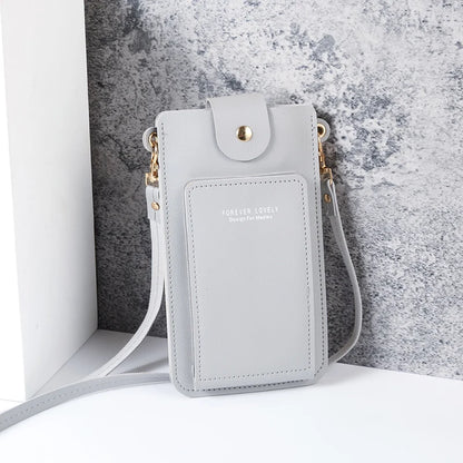 Modern shoulder bag in a solid color, with compartments for cell phone, wallets, and document holder