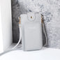 Modern shoulder bag in a solid color, with compartments for cell phone, wallets, and document holder