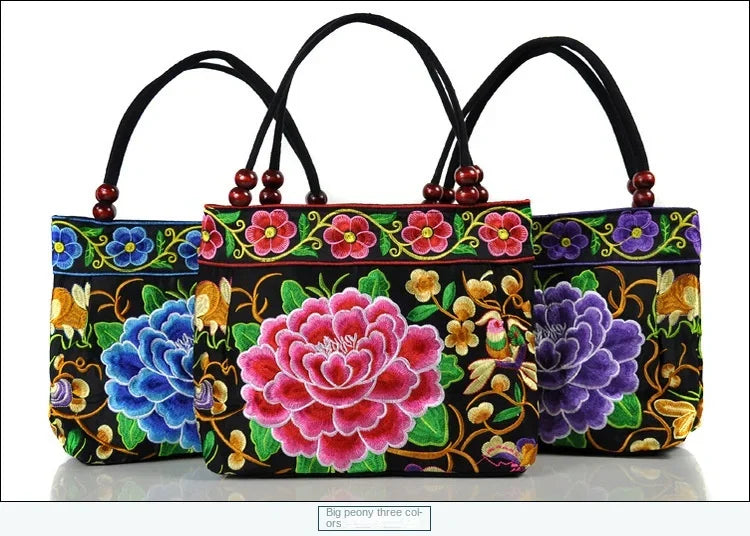 Small women's shoulder bag with floral embroidery, top handle, and flap with bead embellishments