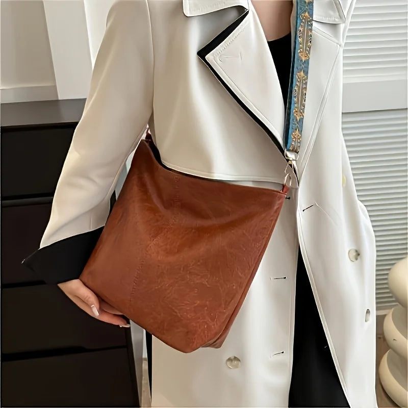 Women's bohemian-style handbag with vintage embroidery and a wide strap