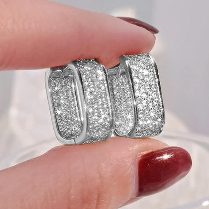 Women's silver or gold hoop earrings set with cubic zirconia