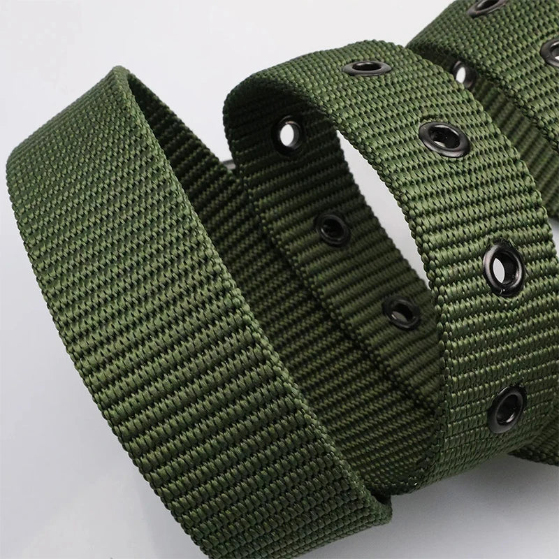 Unisex canvas belt with pin buckle and leather detail. Modern with eyelets and perfect for wearing with jeans.
