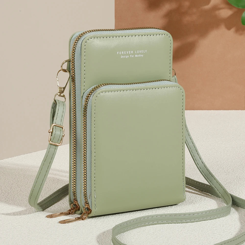 Modern, compact, and secure women's cell phone bag. Holds phones, cards, and documents