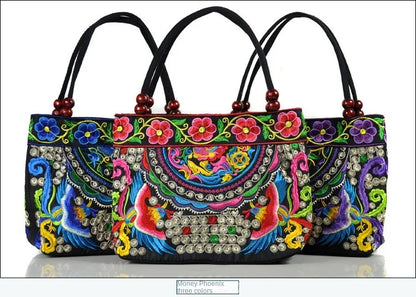 Small women's shoulder bag with floral embroidery, top handle, and flap with bead embellishments