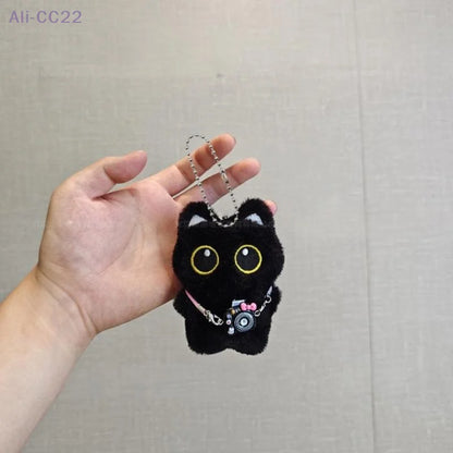 Black and white kitten keychain with big, cute eyes, cartoon plush pendant